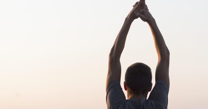man-with-hands-air-looking-sky